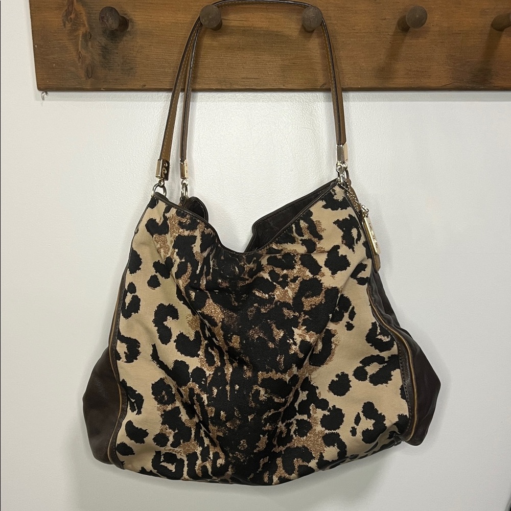 Coach Madison Ocelot Phoebe Leopard Print Purse with Brown and Gold Accents.